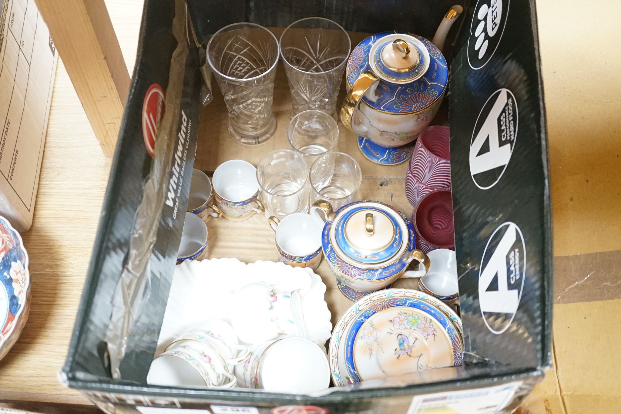 A collection of French provincial plates, various cut glass wine glasses and a Japanese Imari bowl.